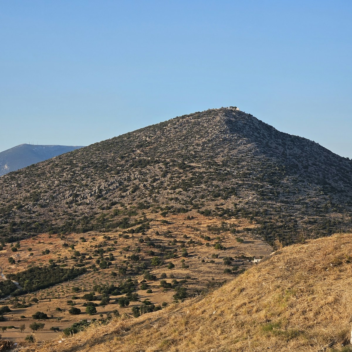 a mountain with a hill in the background